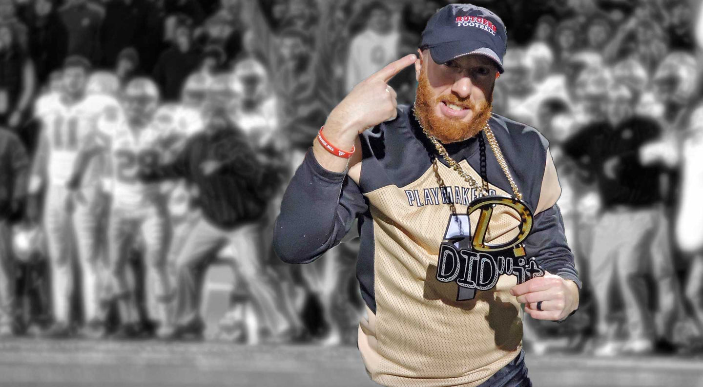 Photo of a football player holding up a turnover chain